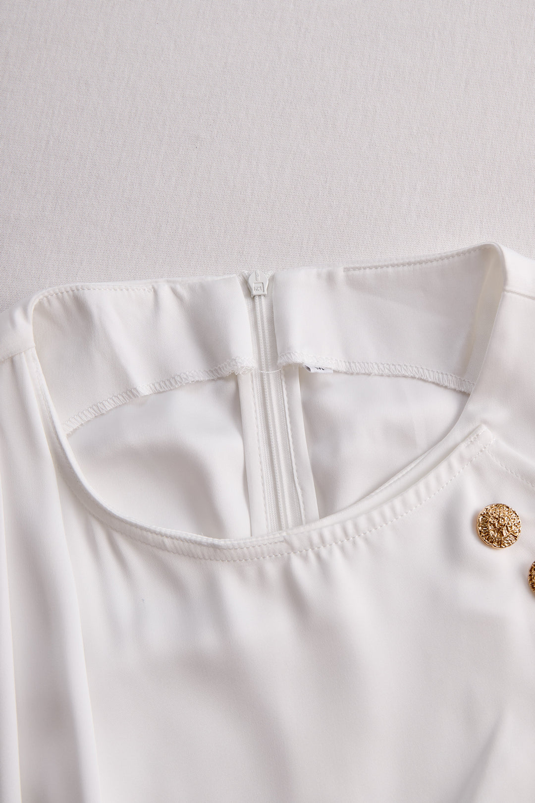 Elegant White Draped Top with Button Detail